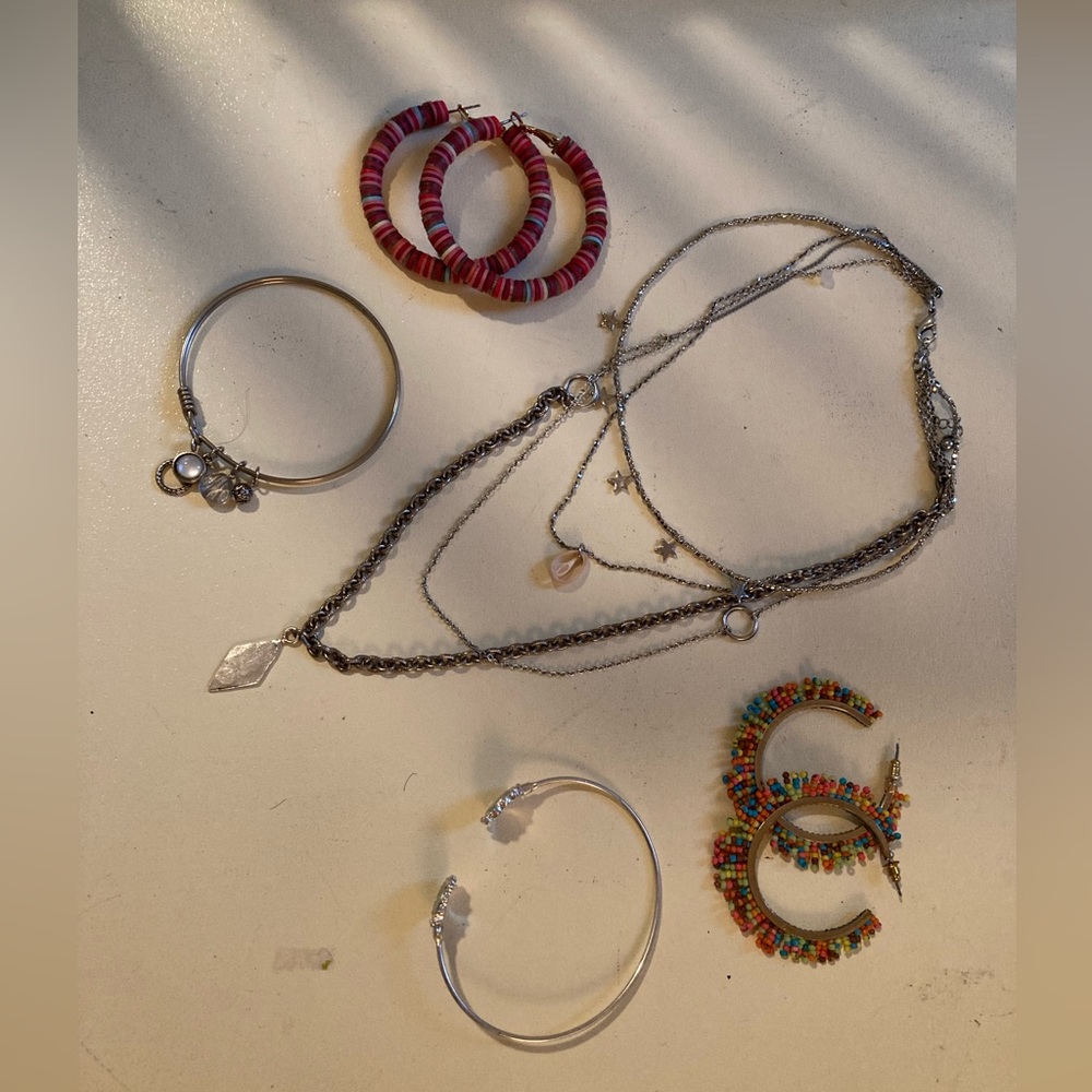 Free People jewelry layering necklace bracelets and bright hoop earrings